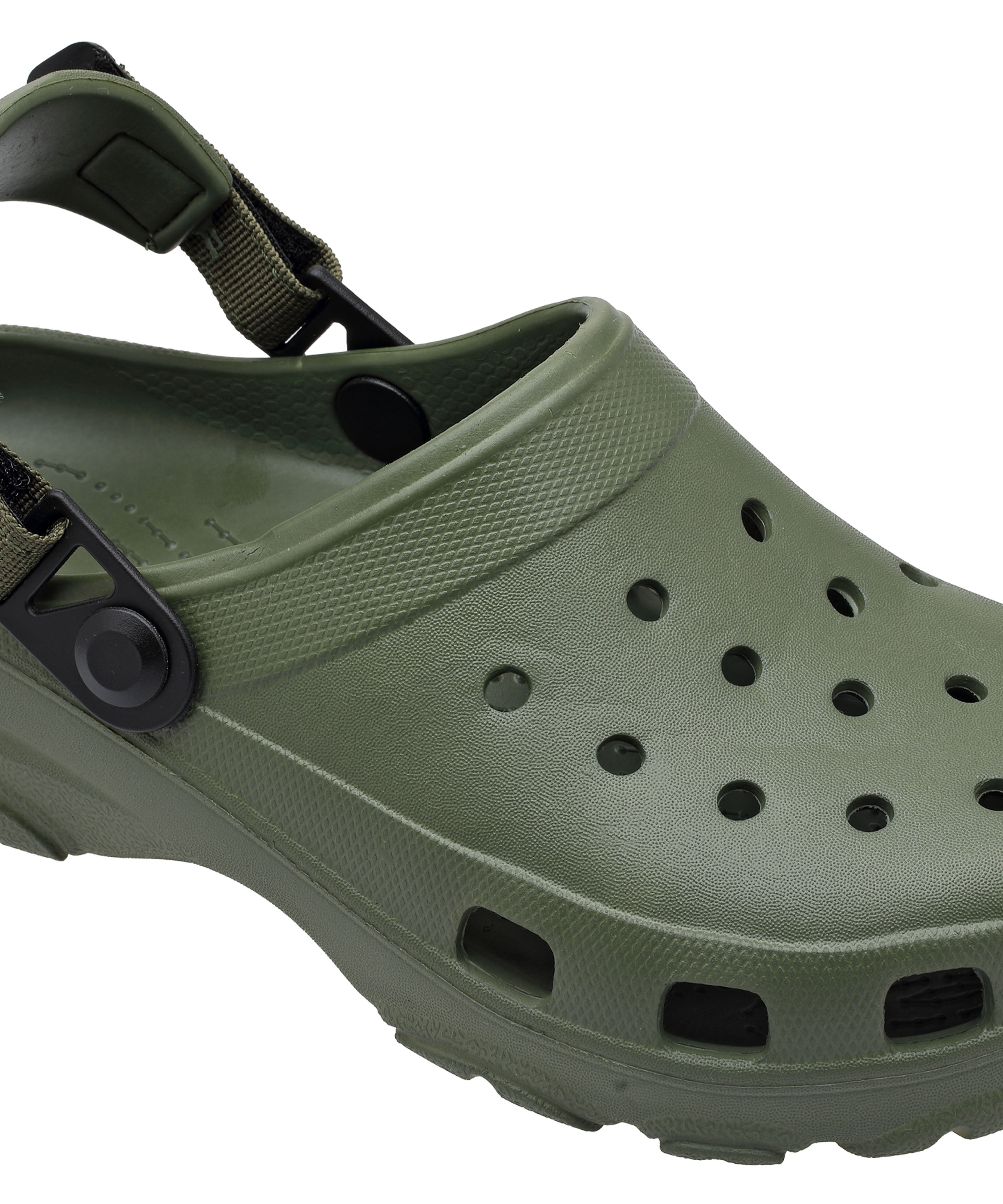 Green clog shoe with a strap on a white background