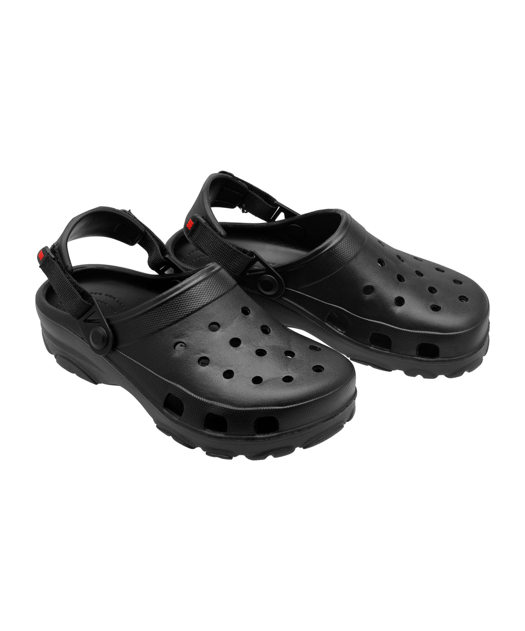 Pair of black clogs on a white background